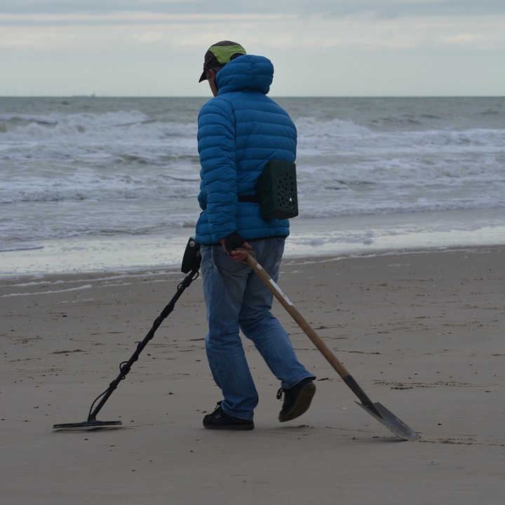 man using metal detector